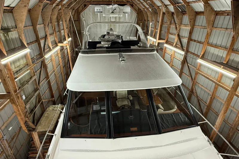 Bonnie Jean Yacht Photos Pics 1998 Ocean Alexander Pilothouse Model 584 yacht stored in a wooden boathouse.