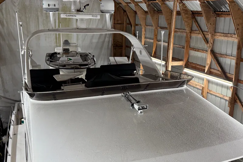 Bonnie Jean Yacht Photos Pics 1998 Ocean Alexander Pilothouse Model 584 yacht in a wooden boathouse.