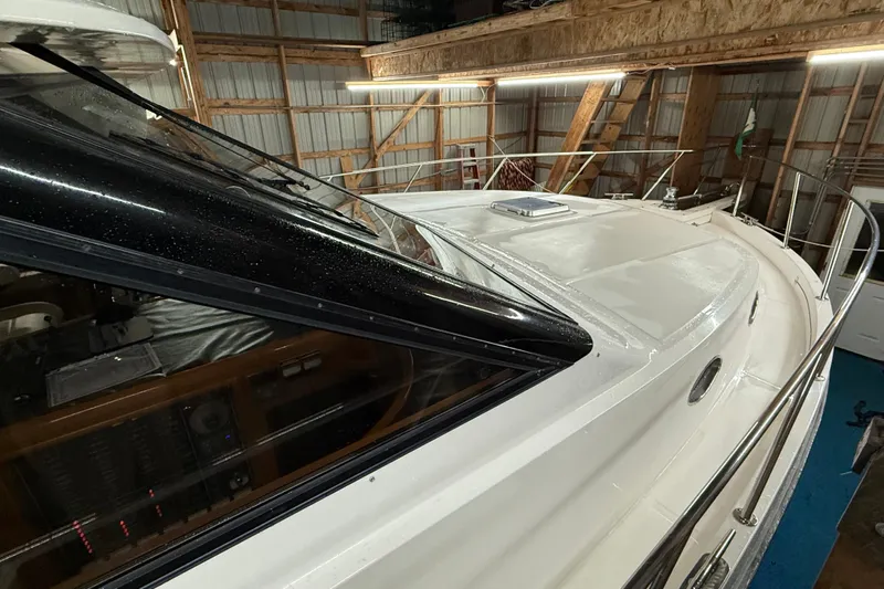 Bonnie Jean Yacht Photos Pics 1998 Ocean Alexander Pilothouse Model 584 in a wooden boathouse, showcasing sleek design.