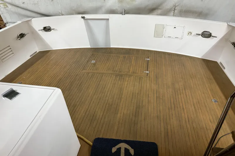 Bonnie Jean Yacht Photos Pics 1998 Ocean Alexander Pilothouse Model 584, teak deck, spacious cockpit, white interior walls.