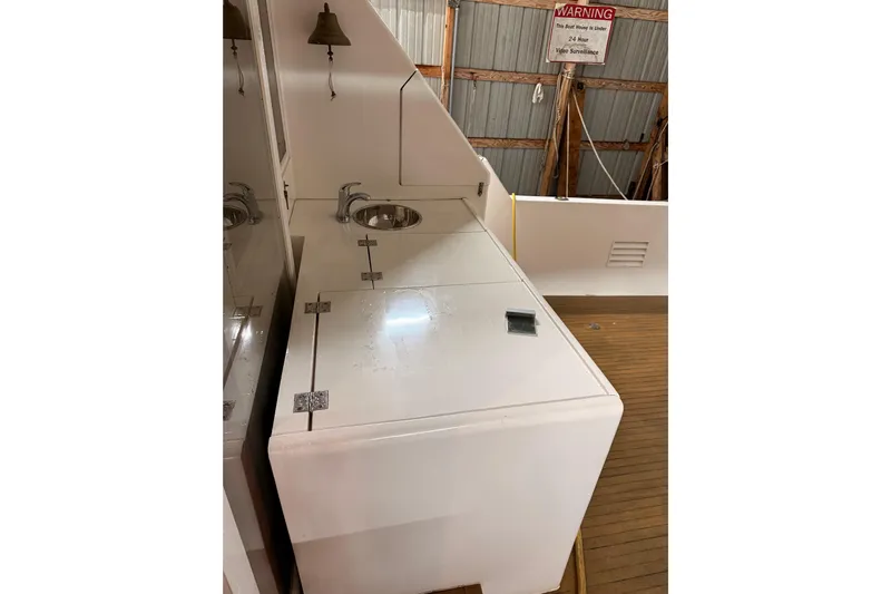 Bonnie Jean Yacht Photos Pics 1998 Ocean Alexander Pilothouse Model 584 interior with sink and storage area.