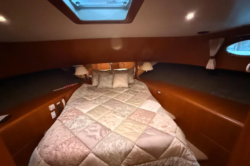 Bonnie Jean Yacht Photos Pics Luxurious bedroom in 1998 Ocean Alexander Pilothouse Model 584 yacht with skylight.