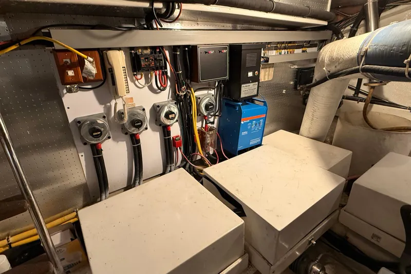 Bonnie Jean Yacht Photos Pics Electrical system of 1998 Ocean Alexander Pilothouse Model 584 yacht, featuring control panels and wiring.