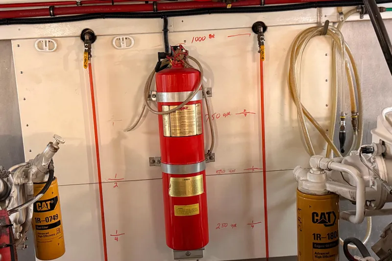 Bonnie Jean Yacht Photos Pics Engine room of 1998 Ocean Alexander Pilothouse Model 584 with fire extinguisher and fuel filters.