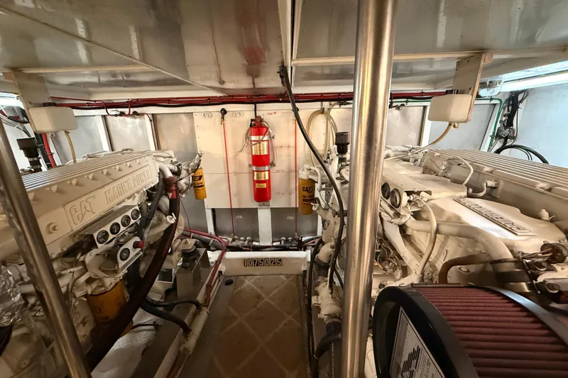 Bonnie Jean Yacht Photos Pics Engine room of 1998 Ocean Alexander Pilothouse Model 584 with CAT Marine Power engines.