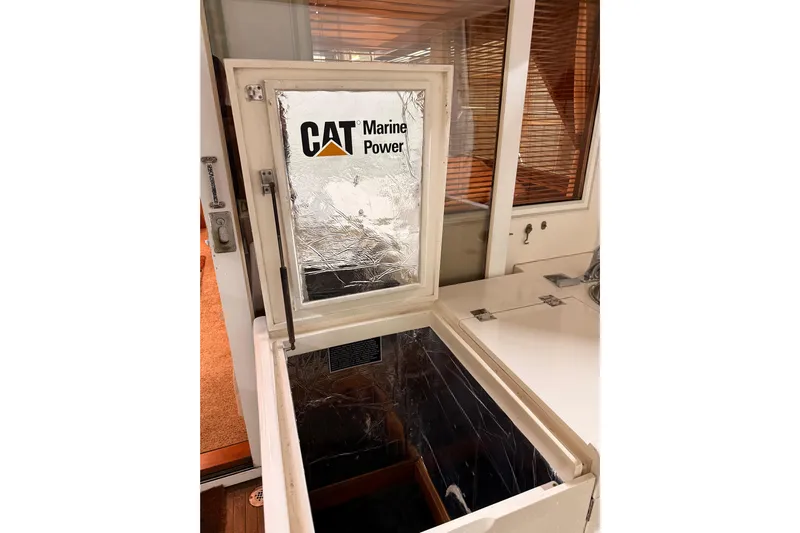 Bonnie Jean Yacht Photos Pics Engine compartment of 1998 Ocean Alexander Pilothouse Model 584 with CAT Marine Power.