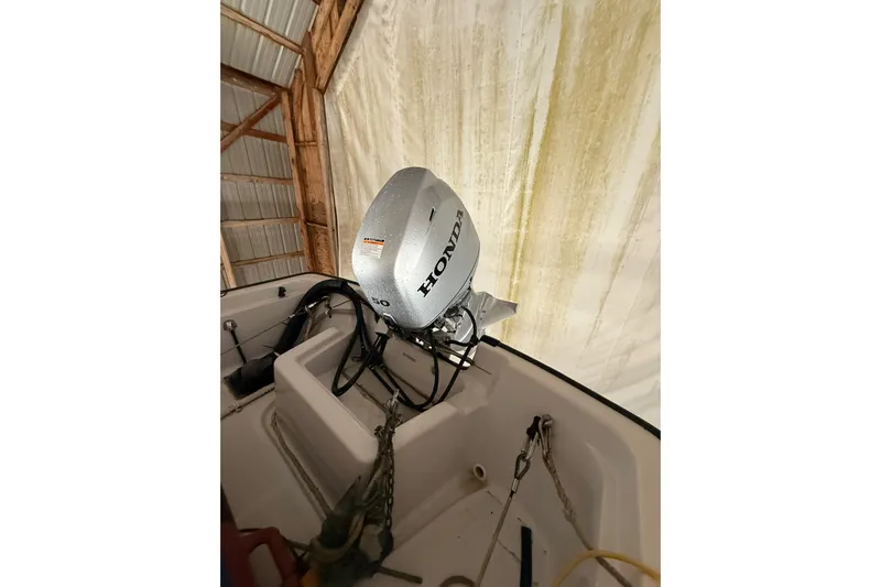 Bonnie Jean Yacht Photos Pics 1998 Ocean Alexander Pilothouse Model 584 with Honda outboard motor in storage.