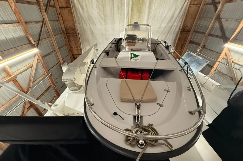 Bonnie Jean Yacht Photos Pics 1998 Ocean Alexander Pilothouse Model 584 in a wooden boathouse, showcasing deck and equipment.