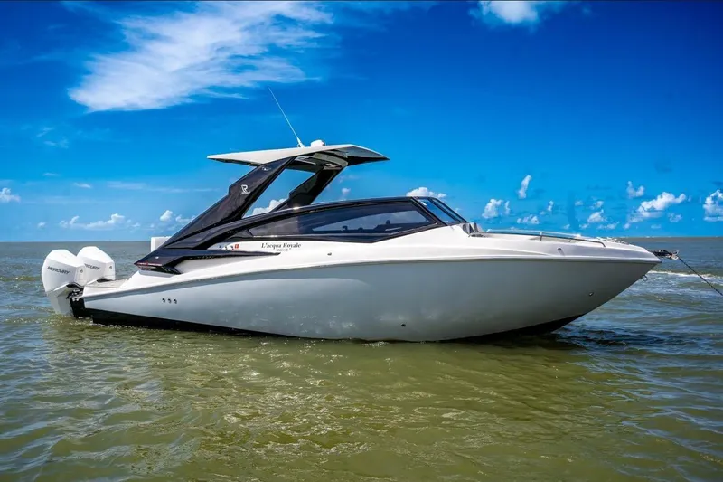 Lr280 Yacht Photos Pics 2024 L'acqua Royale LR280 GRAN CABRIO luxury boat on open water under clear blue sky.