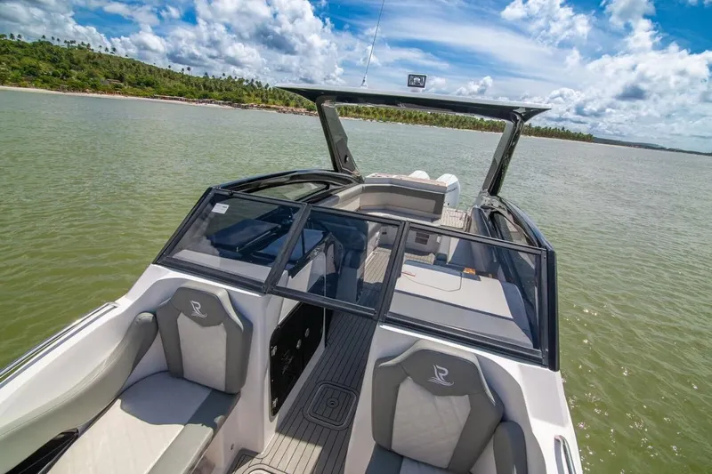 Lr280 Yacht Photos Pics 2024 L'acqua Royale LR280 GRAN CABRIO luxury boat on serene water under blue sky.