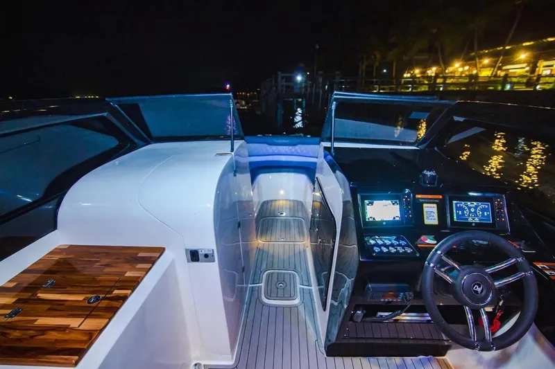 Lr280 Yacht Photos Pics 2024 L'acqua Royale LR280 GRAN CABRIO yacht interior at night, featuring sleek dashboard and controls.
