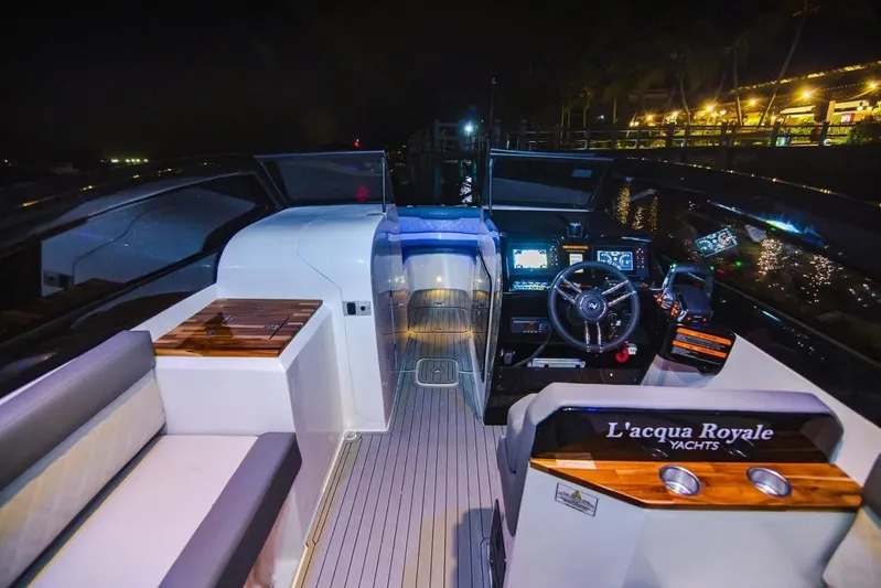 Lr280 Yacht Photos Pics 2024 L'acqua Royale LR280 GRAN CABRIO yacht interior at night, featuring modern controls and seating.