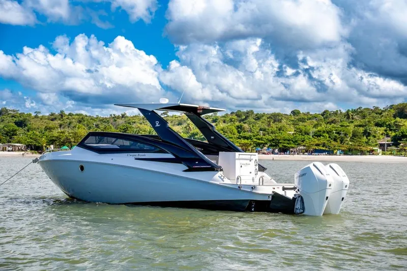 Lr280 Yacht Photos Pics 2024 L'acqua Royale LR280 GRAN CABRIO luxury boat on serene water, lush greenery backdrop.