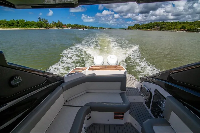 Lr280 Yacht Photos Pics 2024 L'acqua Royale LR280 GRAN CABRIO cruising on a scenic river under a blue sky.
