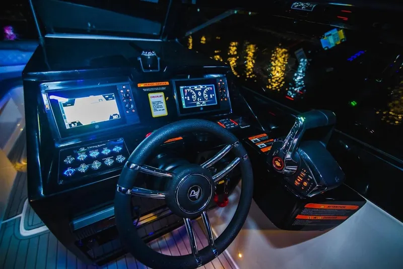 Lr280 Yacht Photos Pics 2024 L'acqua Royale LR280 GRAN CABRIO dashboard with illuminated controls and steering wheel at night.