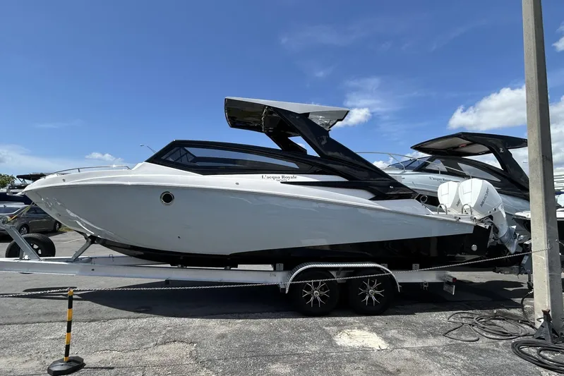 Lr280 Yacht Photos Pics 2024 L'acqua Royale LR280 GRAN CABRIO luxury boat on trailer under clear blue sky.