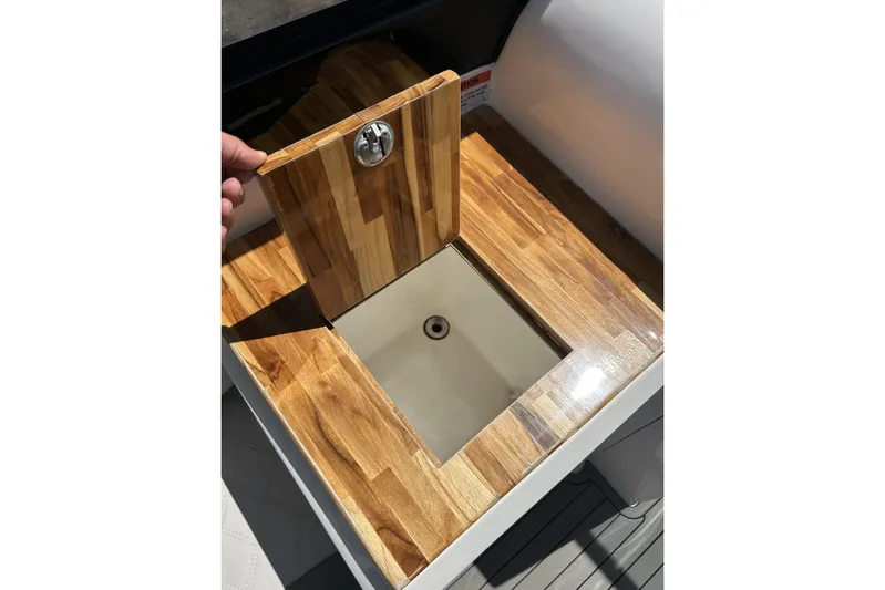 Lr280 Yacht Photos Pics Wooden compartment on 2024 L'acqua Royale LR280 GRAN CABRIO boat, showcasing sleek design.