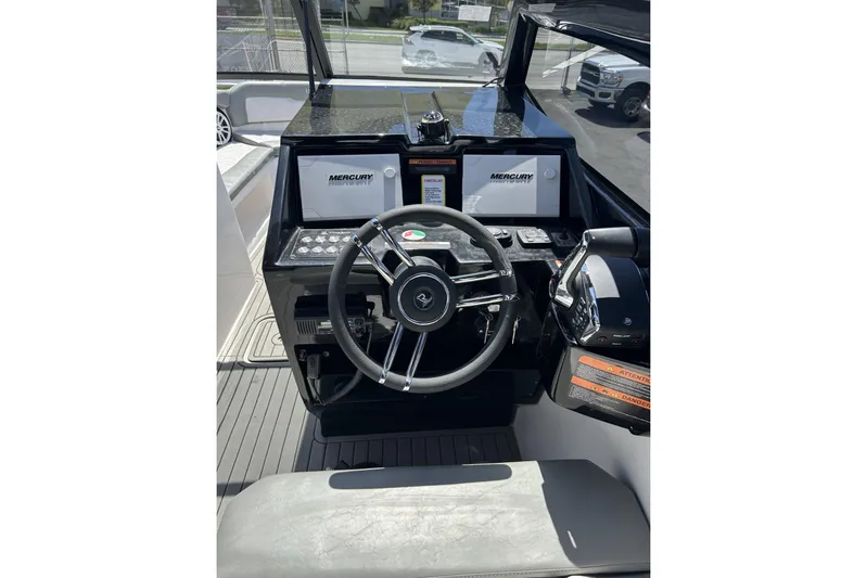 Lr280 Yacht Photos Pics 2024 L'acqua Royale LR280 GRAN CABRIO boat dashboard with steering wheel and Mercury displays.