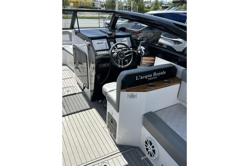 Lr280 Yacht Photos Pics 2024 L'acqua Royale LR280 GRAN CABRIO yacht interior with steering wheel and seating.