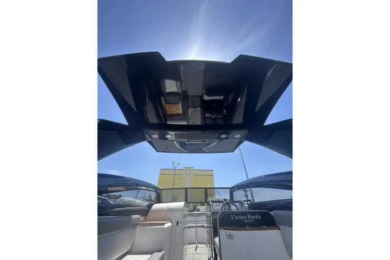 Lr280 Yacht Photos Pics 2024 L'acqua Royale LR280 GRAN CABRIO yacht interior with open roof under clear blue sky.