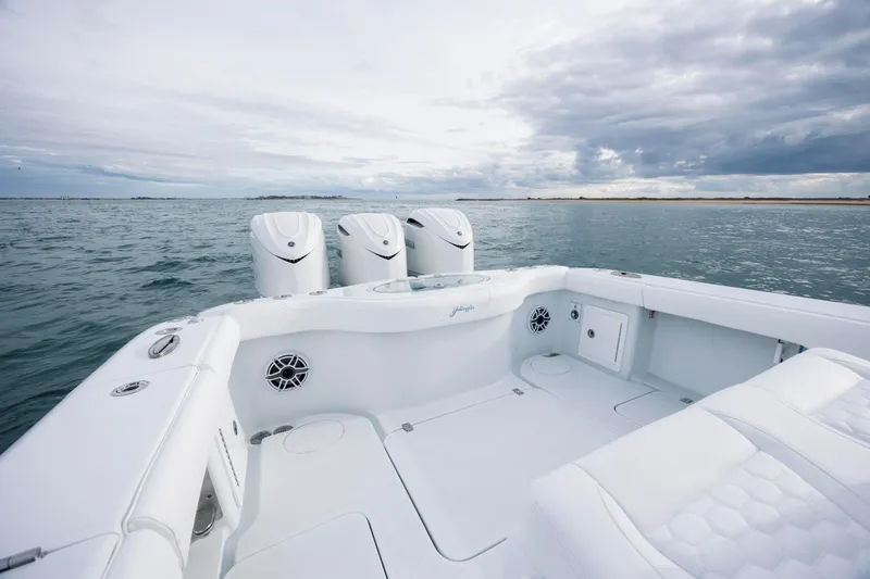  Yacht Photos Pics 2026 Yellowfin 36 Offshore boat with triple engines on open water.
