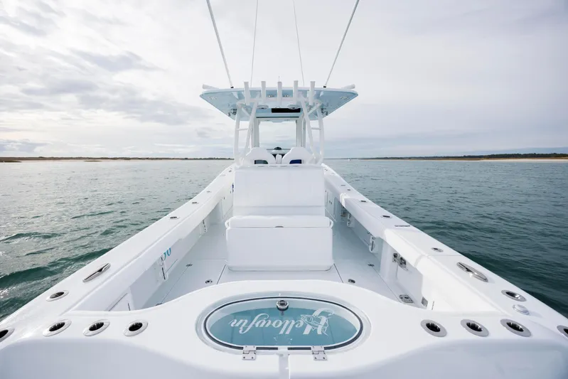  Yacht Photos Pics 2026 Yellowfin 36 Offshore boat on open water, showcasing sleek design and spacious deck.