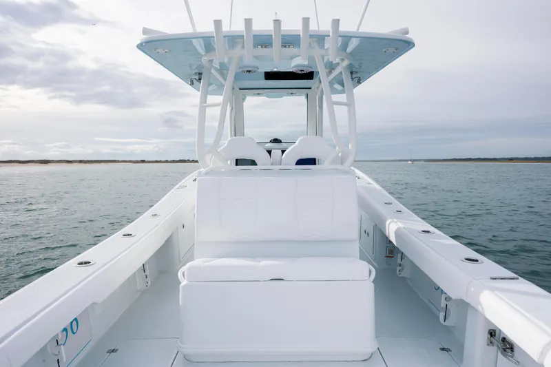  Yacht Photos Pics 2026 Yellowfin 36 Offshore boat on calm water, showcasing sleek design and spacious deck.
