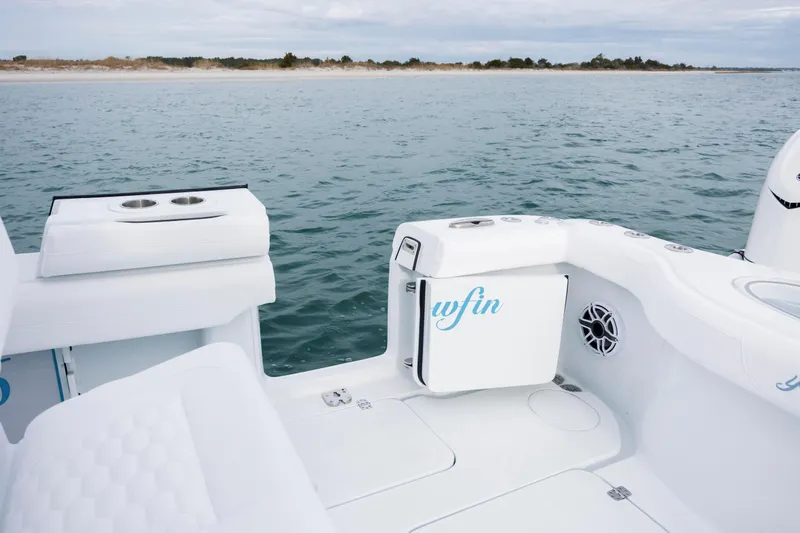  Yacht Photos Pics 2026 Yellowfin 36 Offshore boat interior with ocean view, featuring white seating and cup holders.