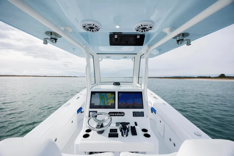  Yacht Photos Pics 2026 Yellowfin 36 Offshore boat dashboard with navigation screens on open water.