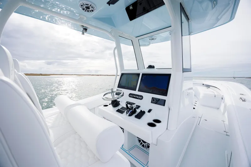  Yacht Photos Pics 2026 Yellowfin 36 Offshore boat interior with modern helm and ocean view.