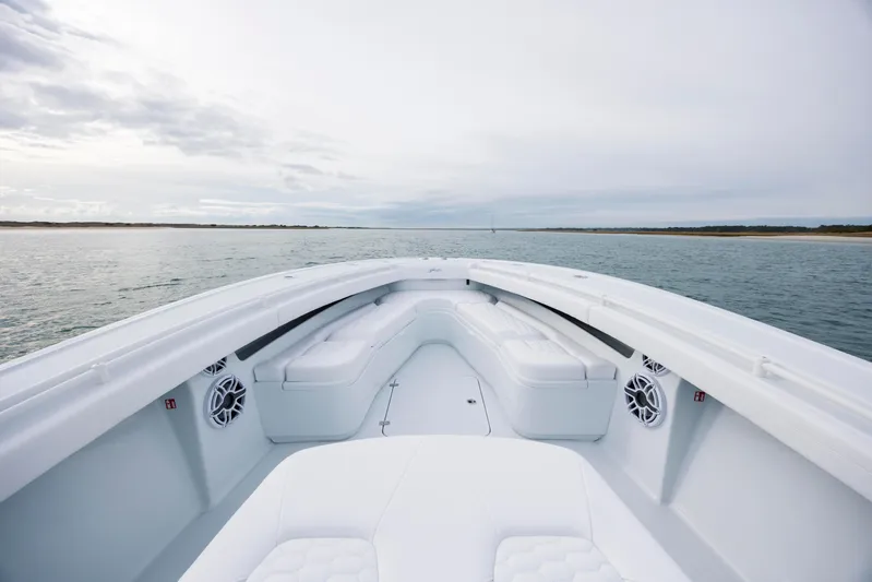  Yacht Photos Pics 2026 Yellowfin 36 Offshore boat with spacious seating on calm waters.