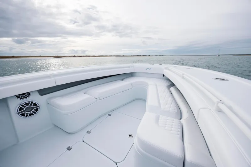  Yacht Photos Pics 2026 Yellowfin 36 Offshore boat interior with white seating, on calm water.