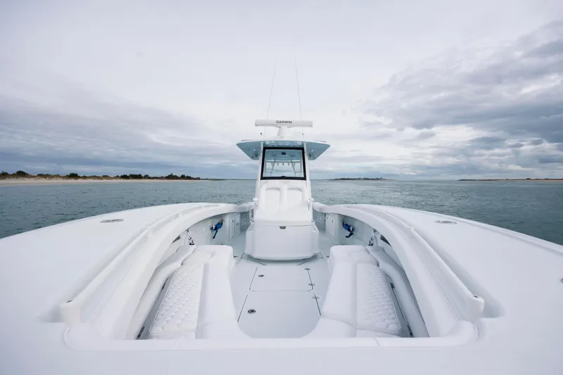  Yacht Photos Pics 2026 Yellowfin 36 Offshore boat on open water under cloudy sky.