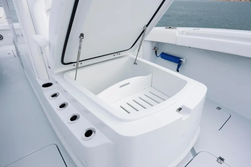  Yacht Photos Pics Open storage compartment on 2026 Yellowfin 36 Offshore boat, featuring sleek white design.