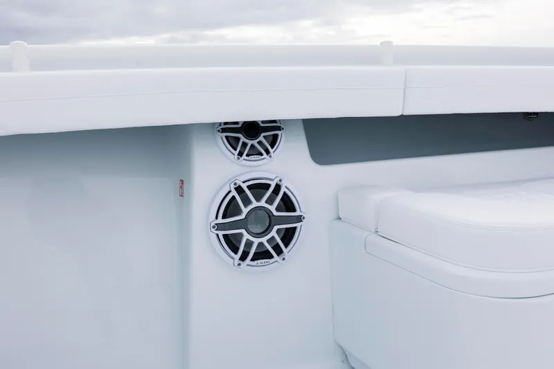  Yacht Photos Pics 2026 Yellowfin 36 Offshore boat interior with speakers and cushioned seating.