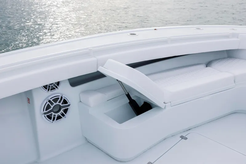  Yacht Photos Pics 2026 Yellowfin 36 Offshore boat interior with white seating and built-in speakers.