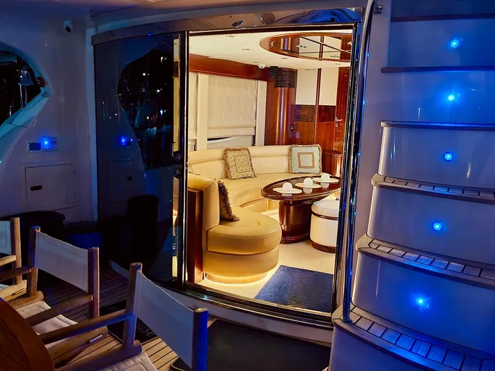  Yacht Photos Pics Luxurious 2010 Majesty 66 Flybridge yacht interior with elegant seating and ambient lighting.