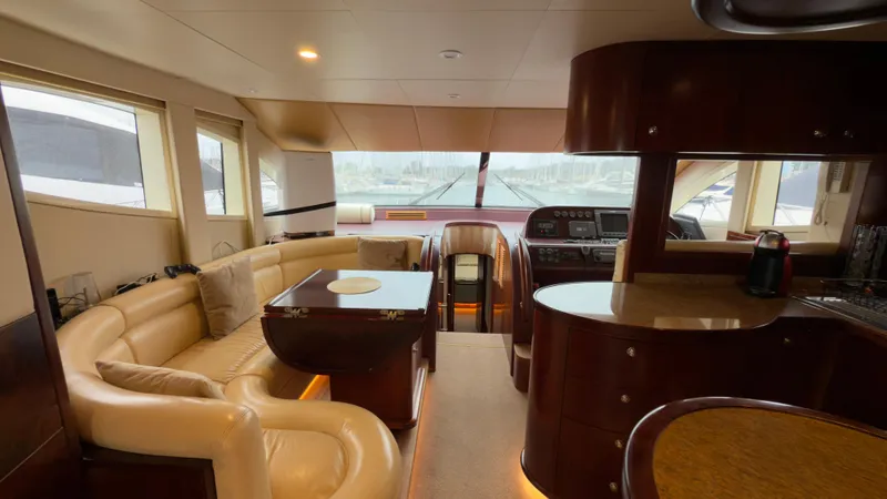  Yacht Photos Pics Luxurious interior of 2010 Majesty 66 Flybridge yacht with elegant seating and modern design.