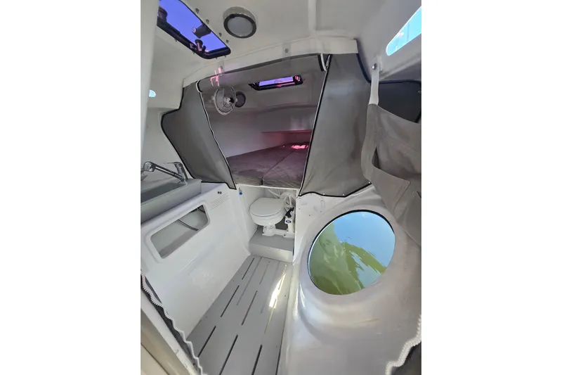 Crush Yacht Photos Pics Interior of 2022 Corsair 880 Sport sailboat, featuring compact cabin amenities.