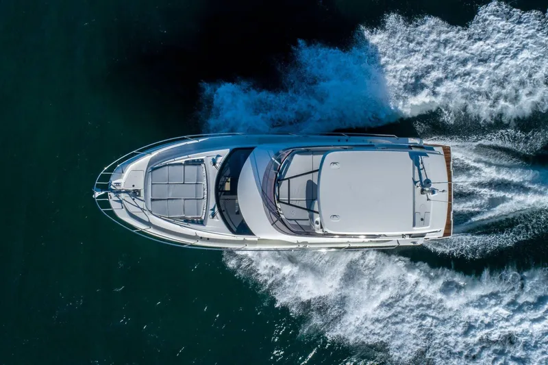  Yacht Photos Pics Aerial view of 2025 Prestige 460 Fly yacht cruising on open water.