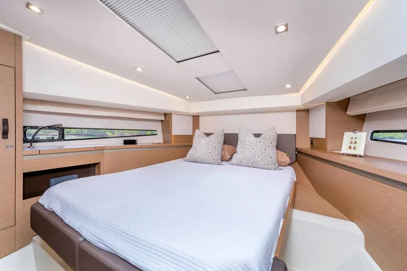  Yacht Photos Pics Luxurious bedroom interior of 2025 Prestige 460 Fly yacht with modern design.