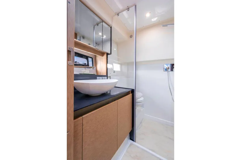  Yacht Photos Pics Luxurious bathroom in 2025 Prestige 460 Fly yacht with modern fixtures and elegant design.
