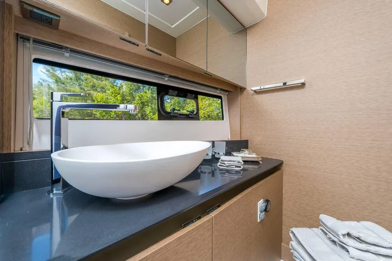  Yacht Photos Pics Luxurious bathroom in 2025 Prestige 460 Fly yacht with modern sink and elegant design.