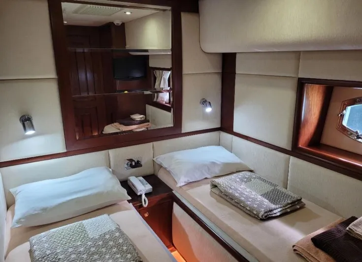  Yacht Photos Pics Luxurious twin cabin interior on 2010 Majesty 66 Flybridge yacht.