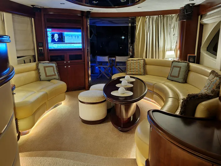  Yacht Photos Pics Luxurious interior of 2010 Majesty 66 Flybridge yacht with elegant seating and modern amenities.