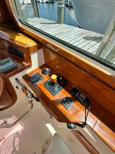  Yacht Photos Pics Helm of 2005 Hinckley 36 boat with wooden dashboard and control instruments.
