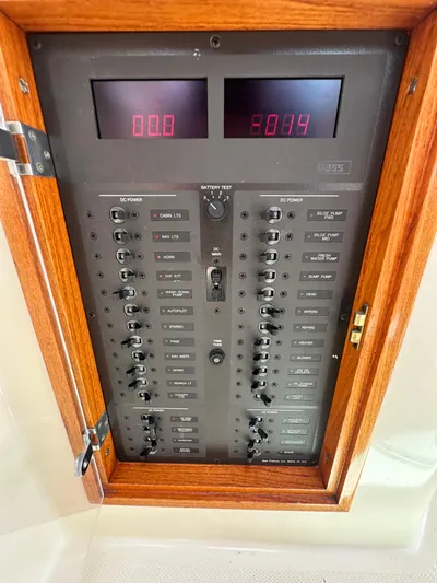  Yacht Photos Pics Electrical control panel of a 2005 Hinckley 36 boat with switches and digital displays.