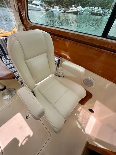  Yacht Photos Pics Luxury seating on a 2005 Hinckley 36 yacht, with a scenic marina view.