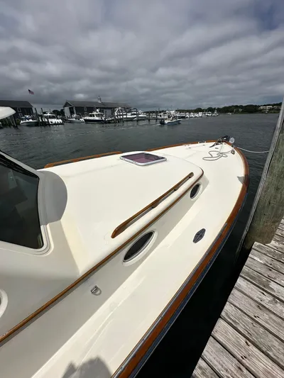  Yacht Photos Pics 2005 Hinckley 36 boat docked at marina under cloudy sky.