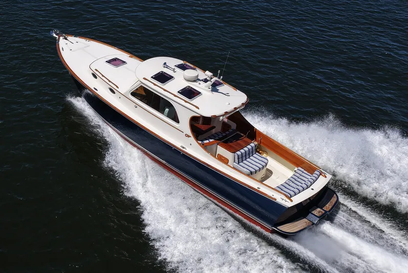  Yacht Photos Pics 2005 Hinckley 36 yacht cruising on open water, showcasing elegant design and speed.